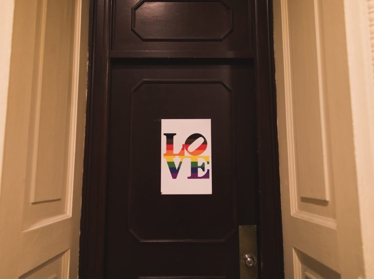 photo of LOVE sign in pride colors on City Hall door in Philadelphia