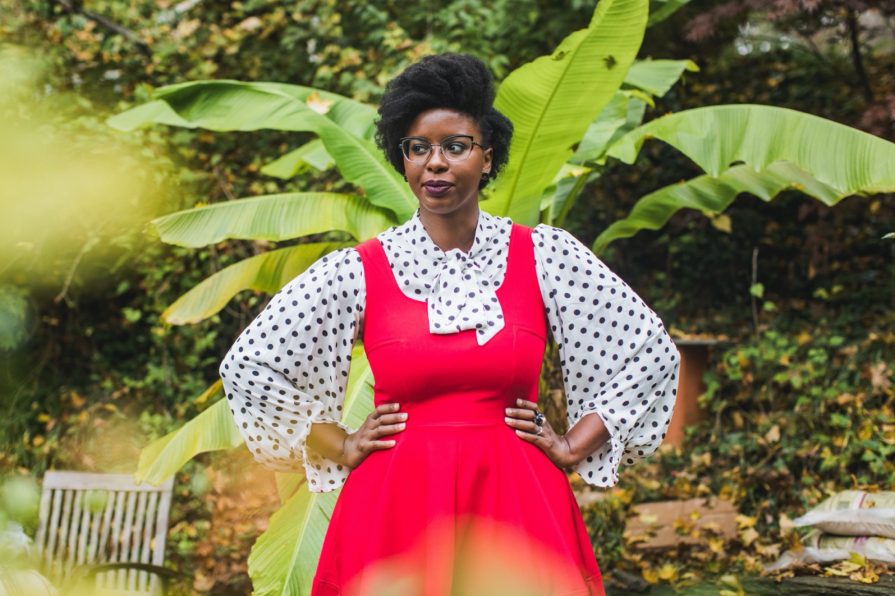 Philadelphia portrait photographer, branding session with Liz, a Black woman who wears a red dress with black and white polka dot blouse