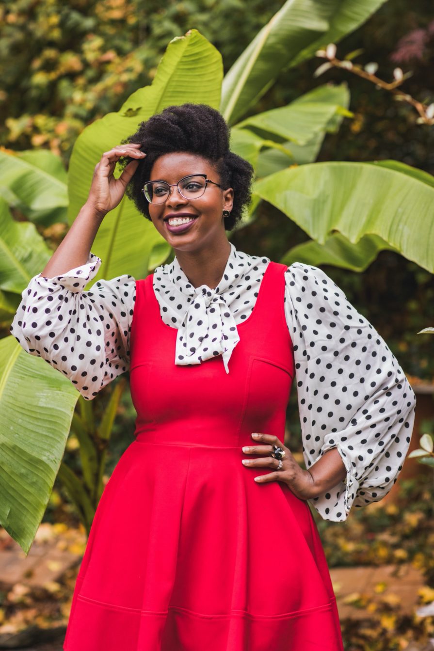 Philadelphia portrait photographer, branding session with Liz, a Black woman who wears a red dress with black and white polka dot blouse