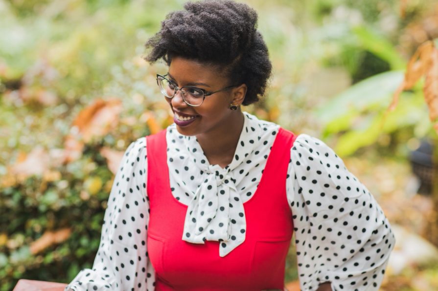 Philadelphia portrait photographer, branding session with Liz, a Black woman who wears a red dress with black and white polka dot blouse
