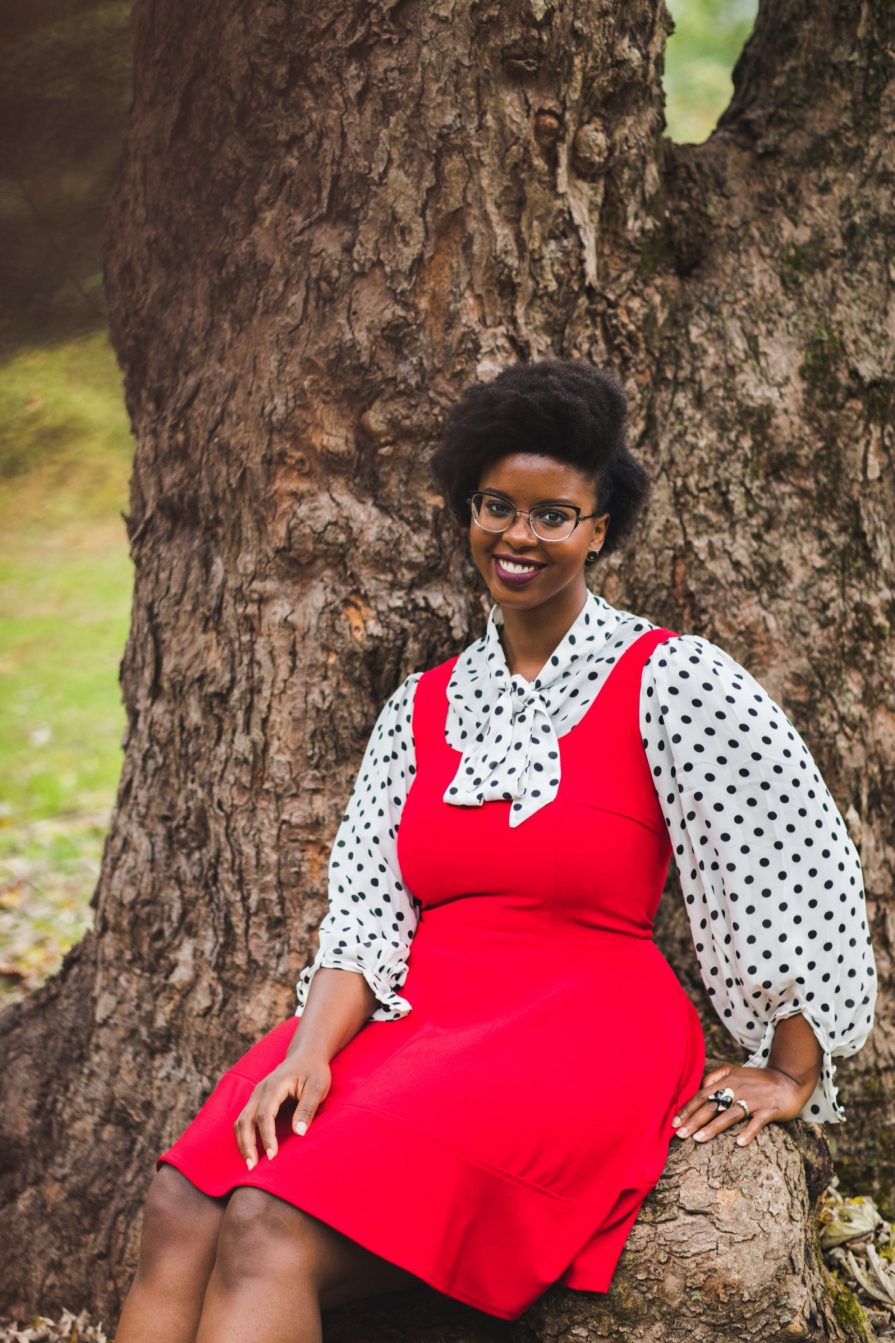 Philadelphia portrait photographer, branding session with Liz, a Black woman who wears a red dress with black and white polka dot blouse