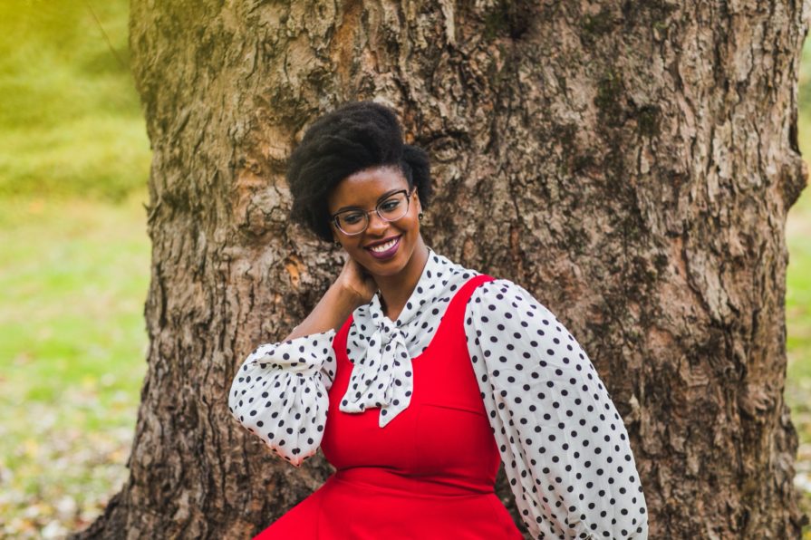 Philadelphia portrait photographer, branding session with Liz, a Black woman who wears a red dress with black and white polka dot blouse