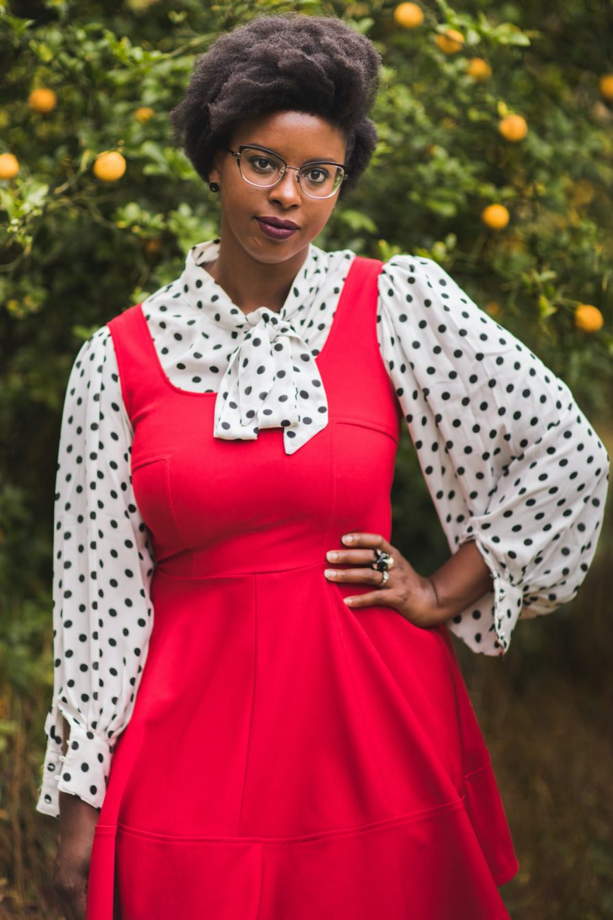 Philadelphia portrait photographer, branding session with Liz, a Black woman who wears a red dress with black and white polka dot blouse