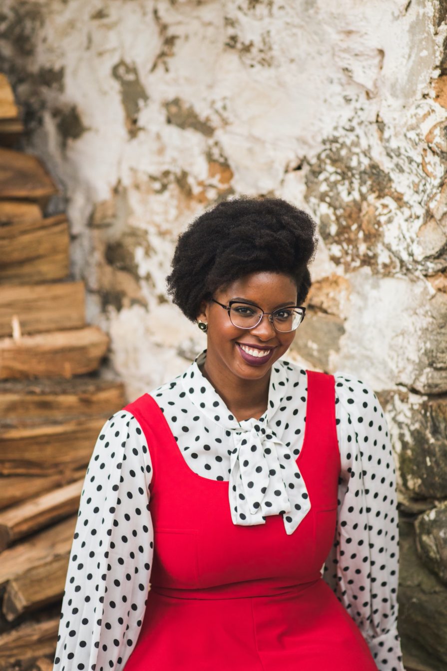 Philadelphia portrait photographer, branding session with Liz, a Black woman who wears a red dress with black and white polka dot blouse