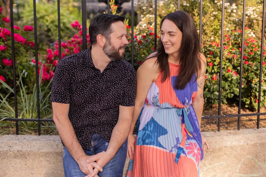 The marriers sitting and smiling together.