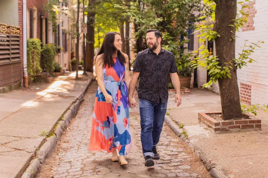 Engagement photos of a couple at Fitler Square in Philadelphia.