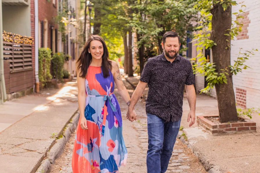 Engagement photos of a couple at Fitler Square in Philadelphia.