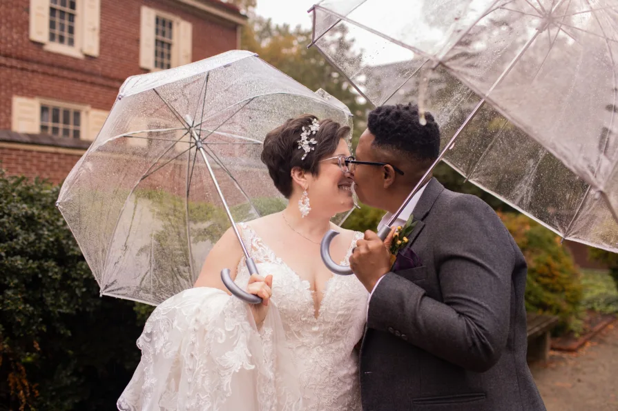 A queer, biracial couple in the rain for their first look in Philadelphia.