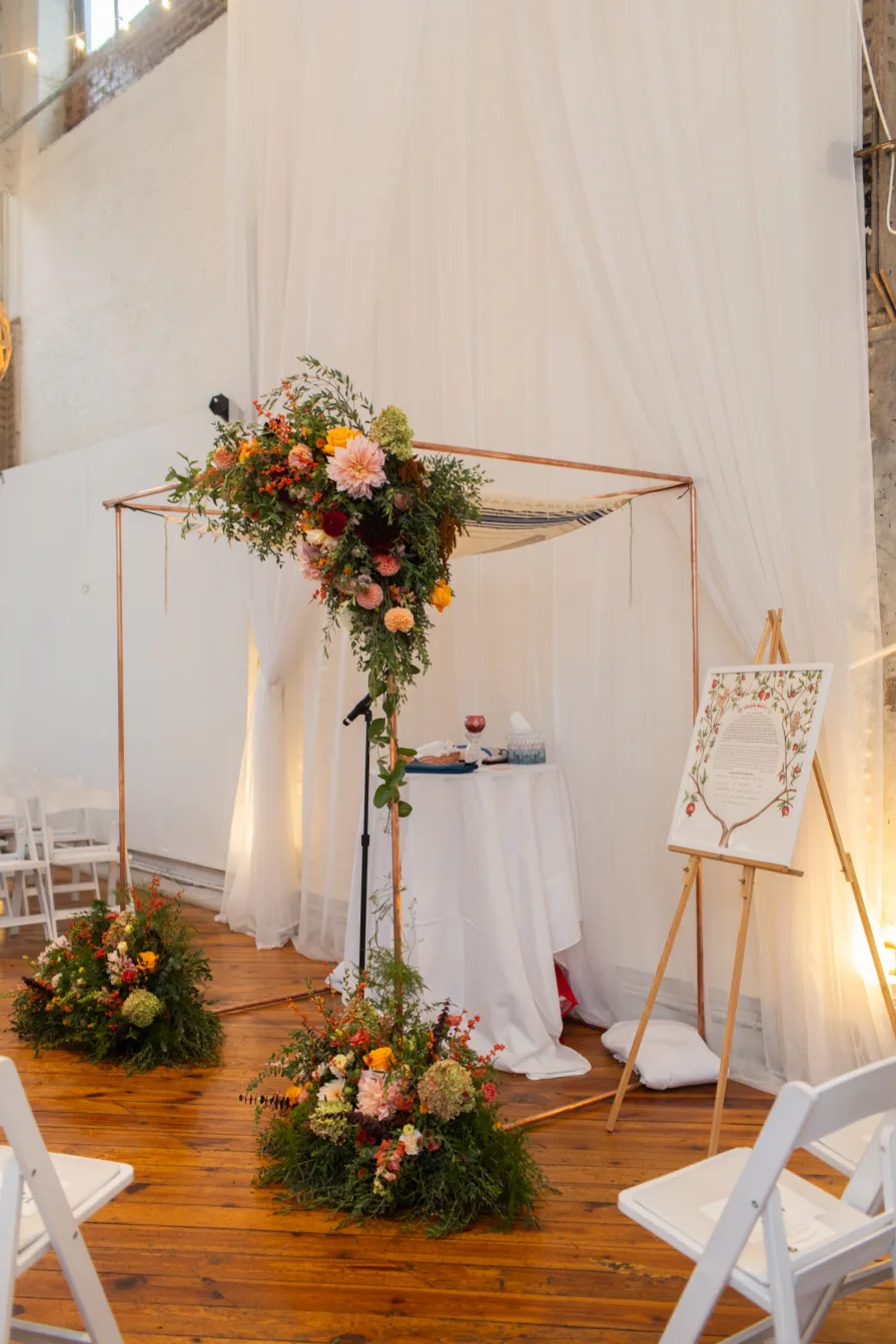 A flower installation on a chuppah at an indoor Philadelphia wedding venue.