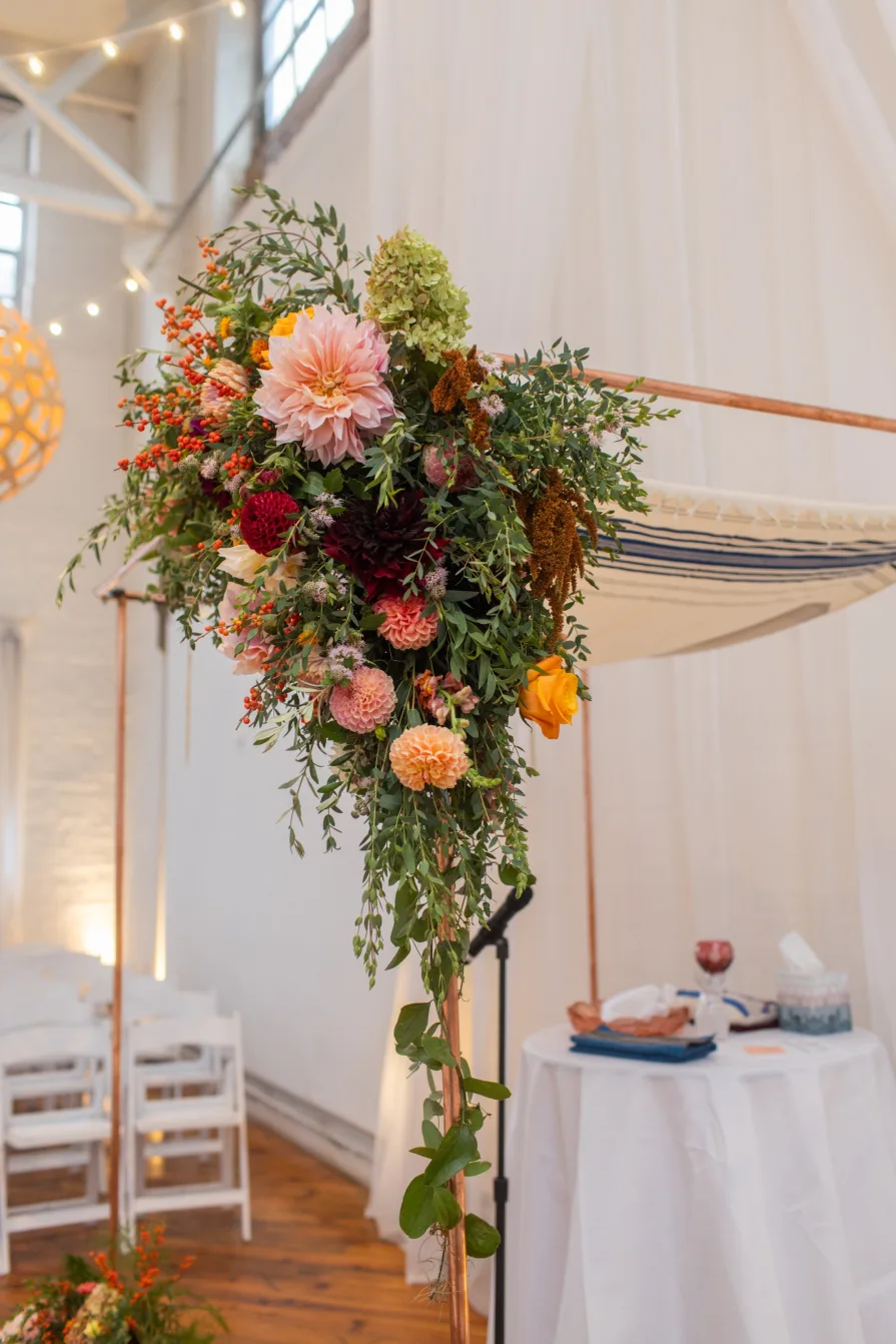 A flower installation on a chuppah at an indoor Philadelphia wedding venue.