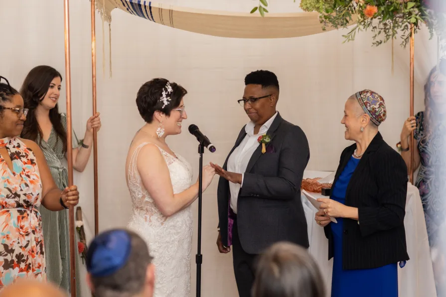 Marriers exchange rings during their indoor wedding ceremony in Old City Philadelphia.