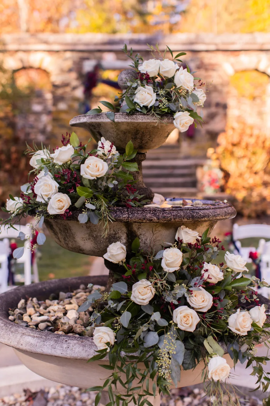 White roses on a fountain at a wedding ceremony
