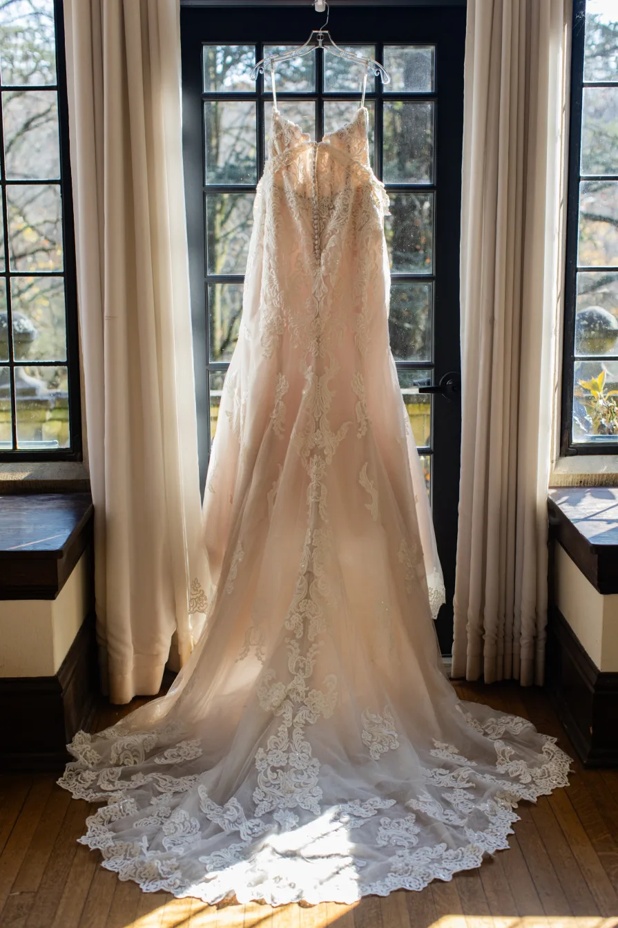 A wedding gown hanging inside the wedding suite at Parque at Ridley Creek State Park.
