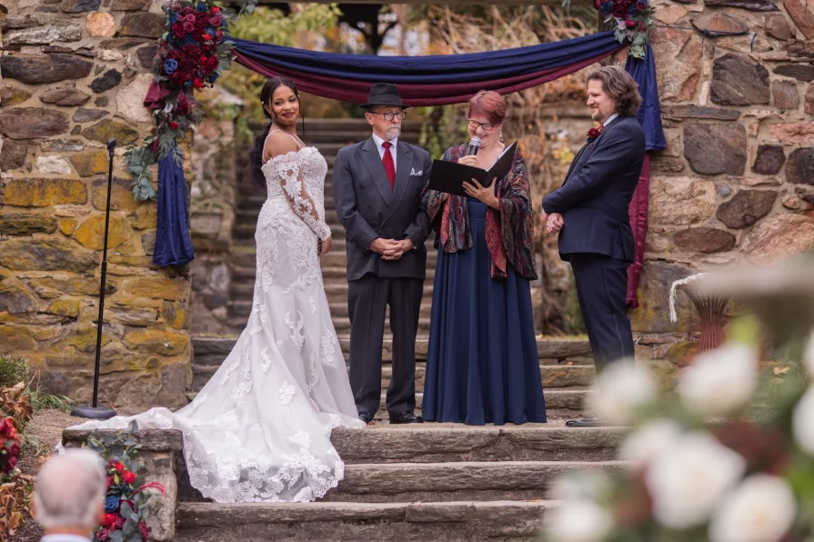 A fall wedding ceremony at Parque at Ridley Creek State Park.