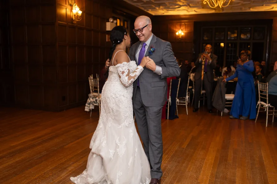 A father daughter dance at a wedding reception.