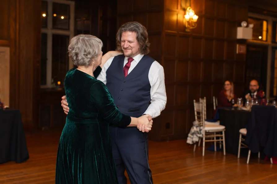 A mother son dance at a wedding reception.