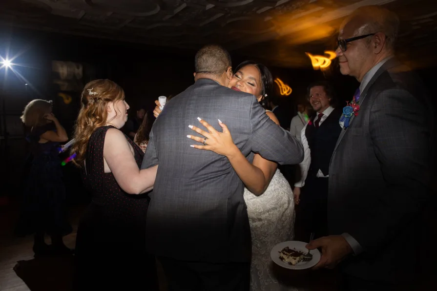 Photos of guests at a wedding reception with a shutter drag.