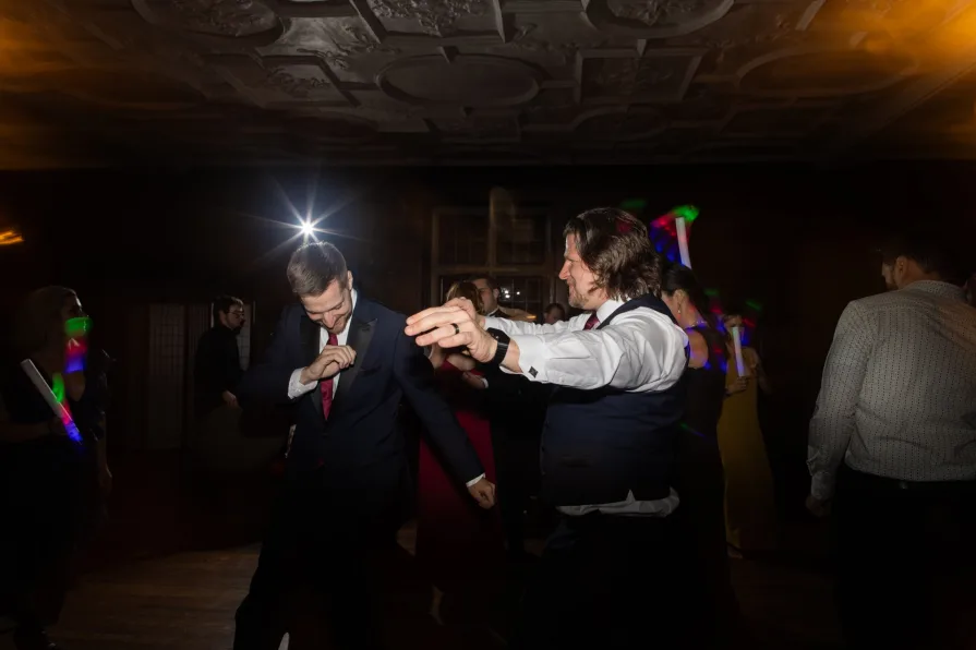 Photos of guests at a wedding reception with a shutter drag.