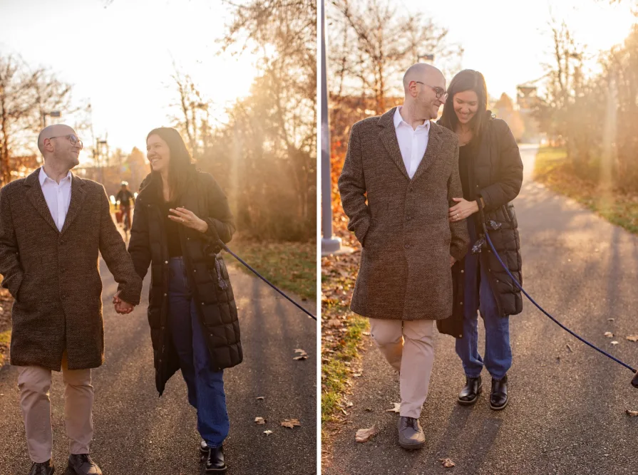 A couple walking with their dog near Schuylkill River Trail after getting engaged in Philadelphia.