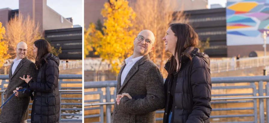A couple walking with their dog near Schuylkill River Trail after getting engaged in Philadelphia.