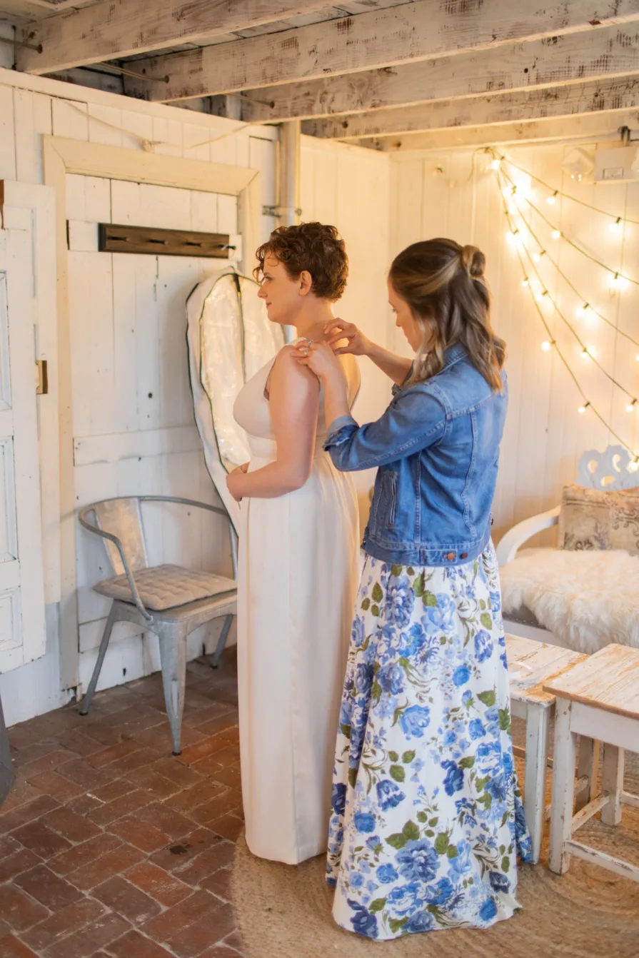 A queer couple getting ready at the Mushroom House at Terrain for their wedding