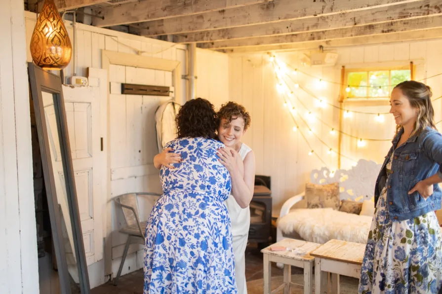 A queer couple getting ready at the Mushroom House at Terrain for their wedding
