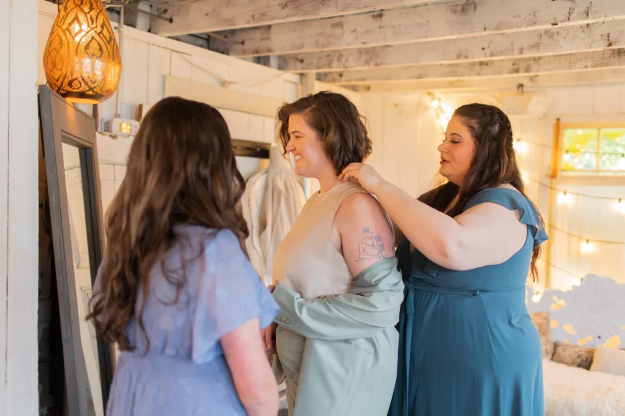 A queer couple getting ready at the Mushroom House at Terrain for their wedding