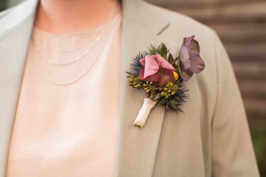 A marrier in a sage green suit