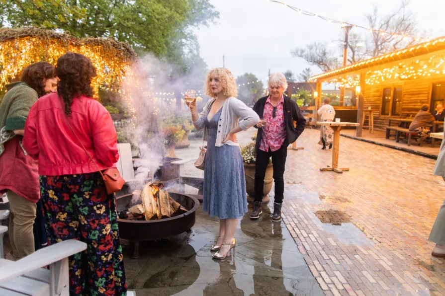 Wedding guests celebrating a queer couple at Terrain at Styer's.