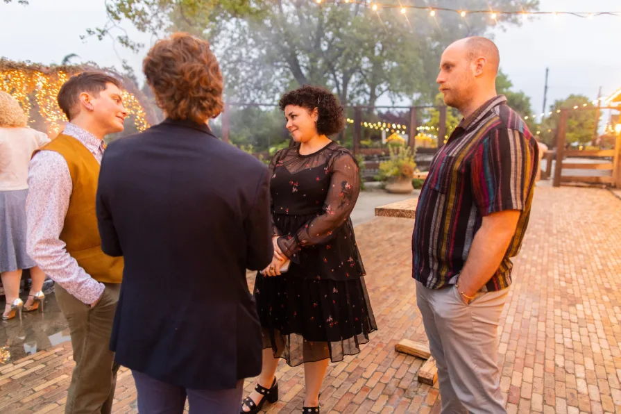 Wedding guests celebrating a queer couple at Terrain at Styer's.