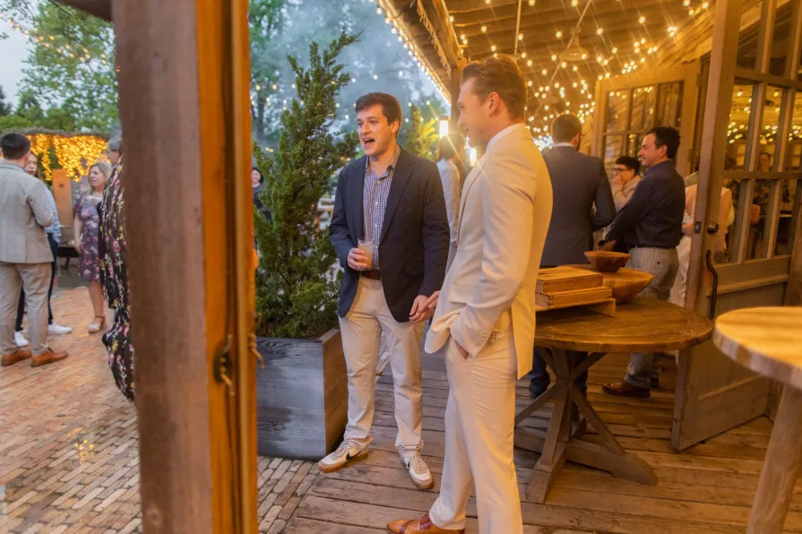 Wedding guests celebrating a queer couple at Terrain at Styer's.
