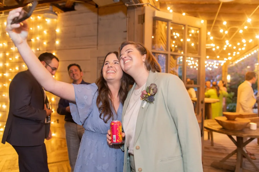 Wedding guests celebrating a queer couple at Terrain at Styer's.