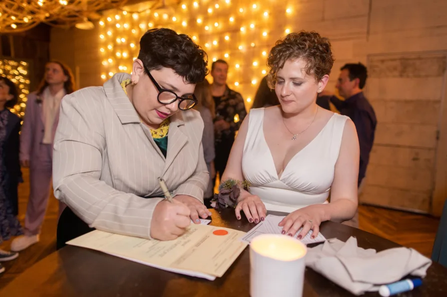 Wedding guests celebrating a queer couple at Terrain at Styer's.