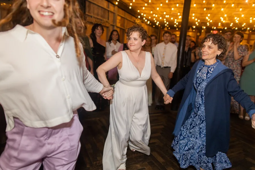 Wedding guests celebrating a queer couple at Terrain at Styer's.