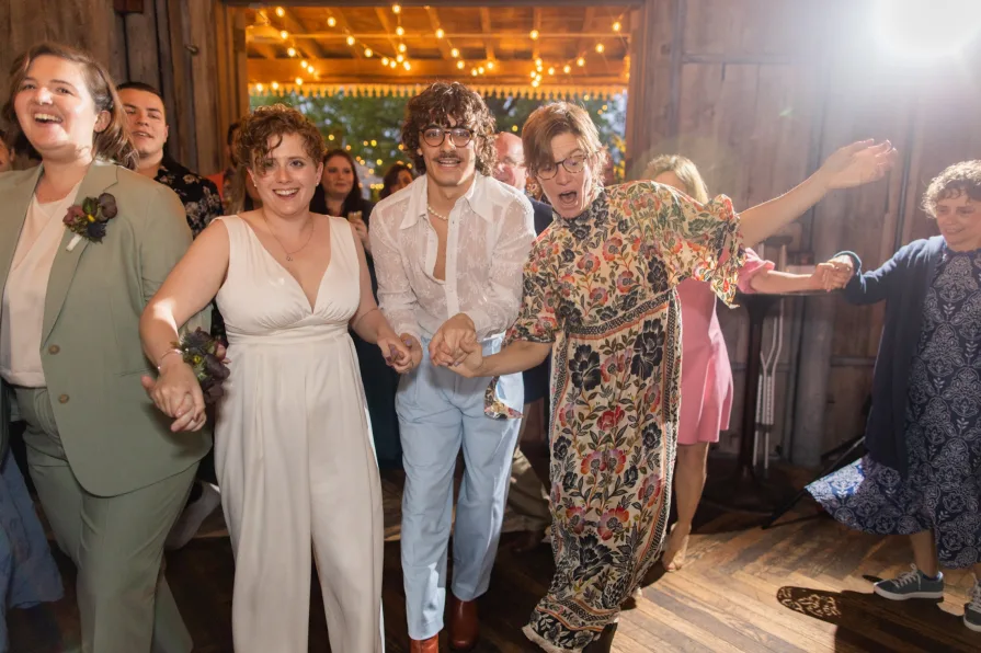 Wedding guests celebrating a queer couple at Terrain at Styer's.