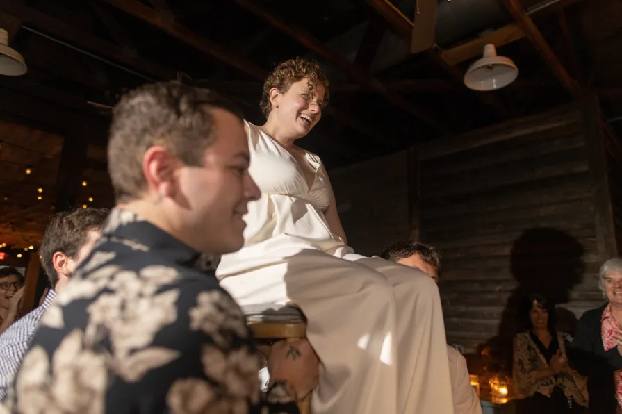Wedding guests celebrating a queer couple at Terrain at Styer's.