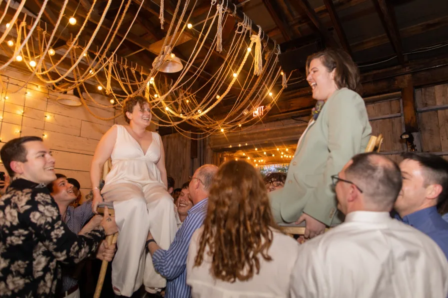Wedding guests celebrating a queer couple at Terrain at Styer's.