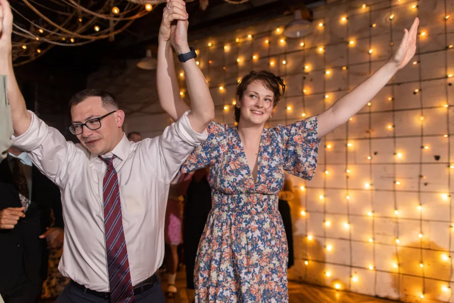 Wedding guests celebrating a queer couple at Terrain at Styer's.